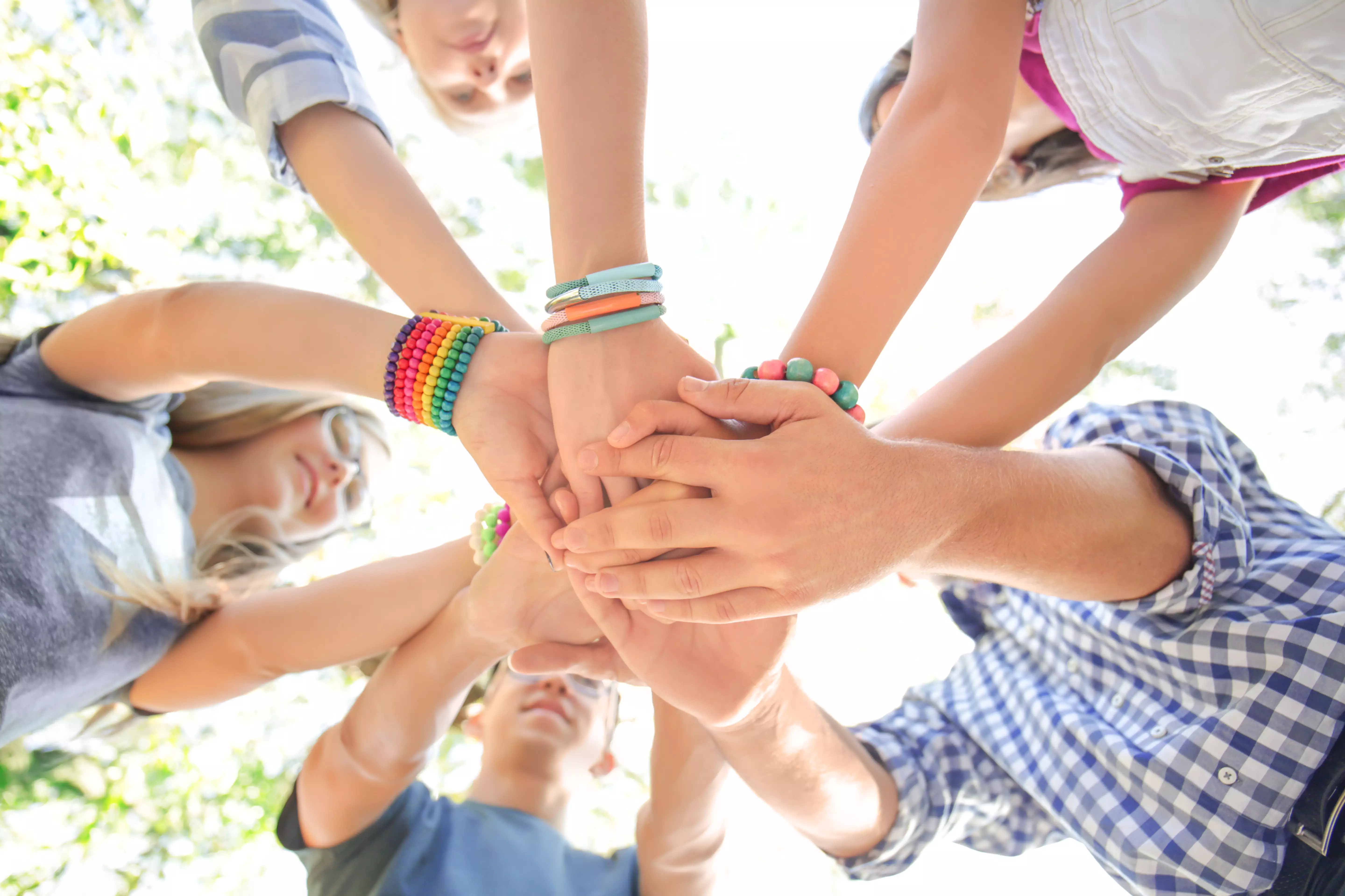 Teenagers holding hands outdoors